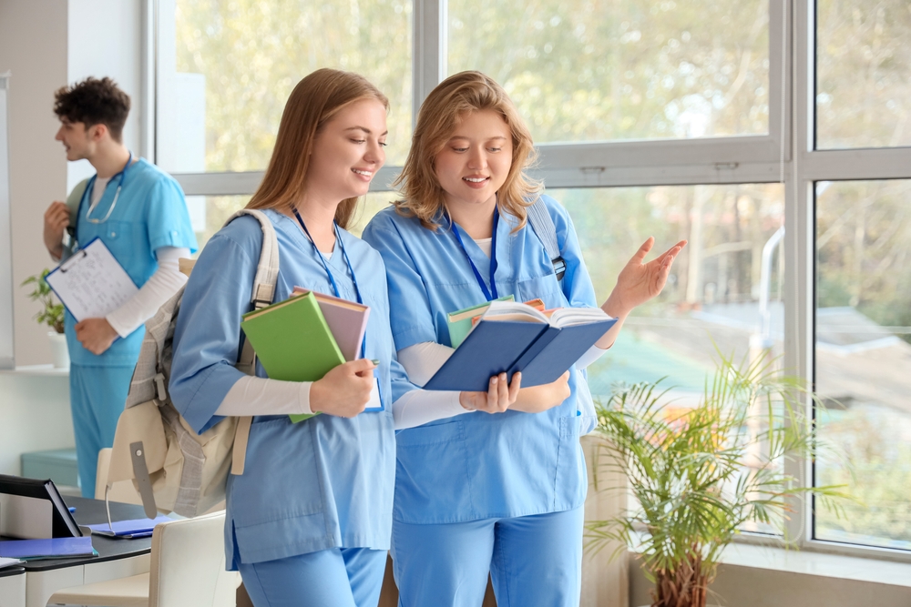 Female,Medical,Students,With,Books,At,University